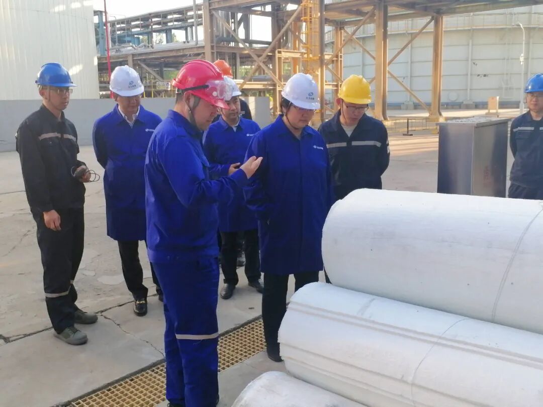 Project team reviewing silica aerogel blanket insulation on site