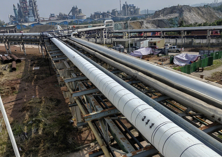Large-scale aerogel insulated process pipelines in a petrochemical facility